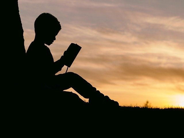 image of boy reading