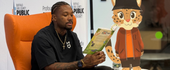 photo man reading children's book 