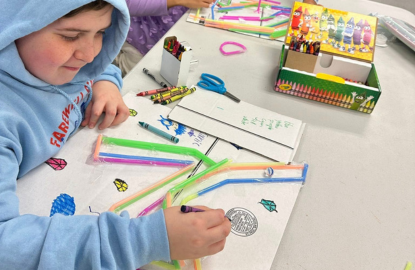 Older child working on a marble maze
