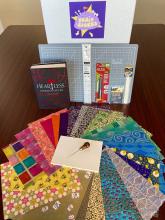picture of bookbinding supplies plus the book Heartless by Marissa Meyer