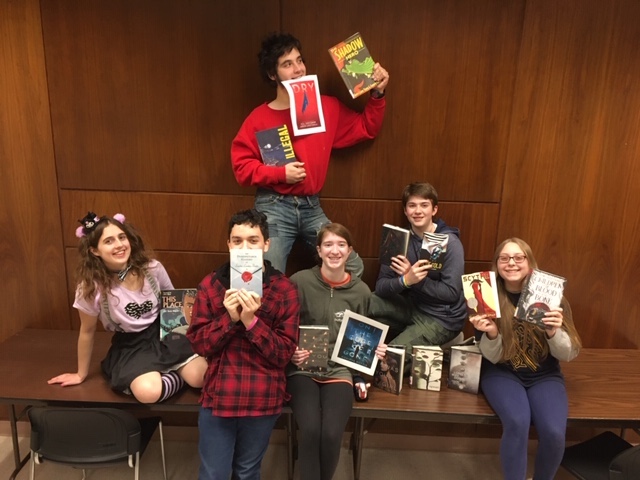 groups of teens holding books