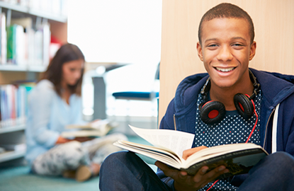 teen holdin a book 